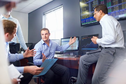 Colleagues in office having discussion, hand gestures