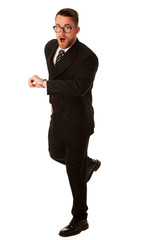 Successful businessman in formal suit chacking time on wrist wat