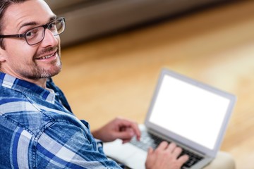 Portrait of man using a laptop