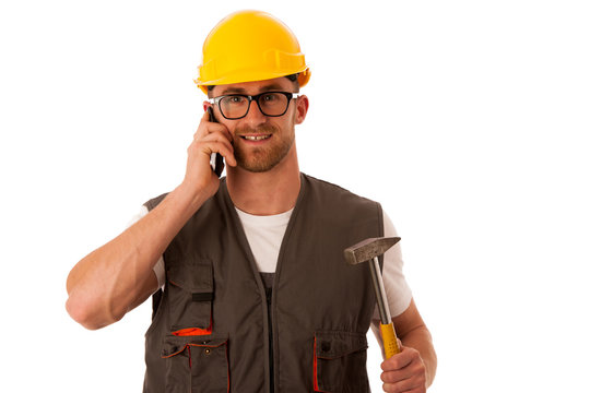 Young worker wtih protective dress and yellow helmet holding ham