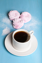 Fresh pink homemade zephyr - marshmallow and white cup of tea on