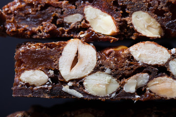 Traditional italian christmas dessert Panforte on dark backgroun