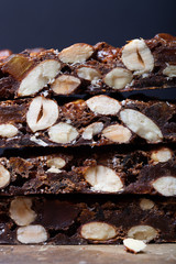 Traditional italian christmas dessert Panforte on dark backgroun