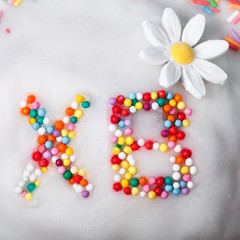 Fragment of Easter cake with letters