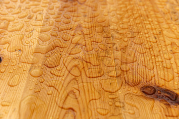 Raindrops on a wooden table