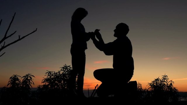 Man surprises his girlfriend with marriage proposal during sunset, super slow motion 240fps
