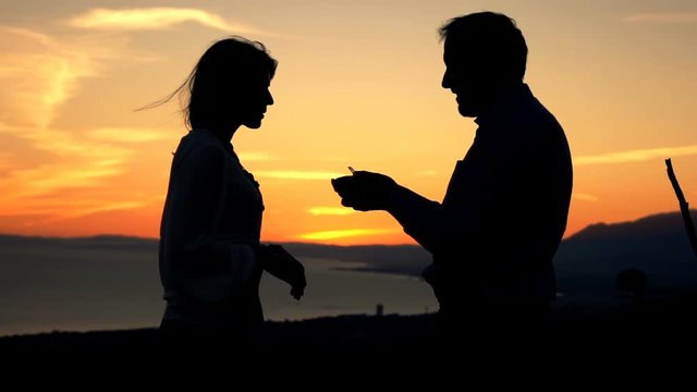 Man surprises his girlfriend with marriage proposal during sunset, super slow motion 240fps
