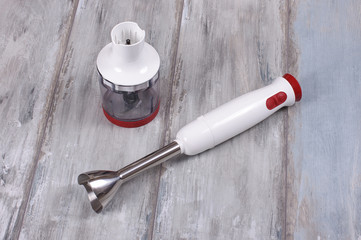 Electric hand blender isolated on the vintage background