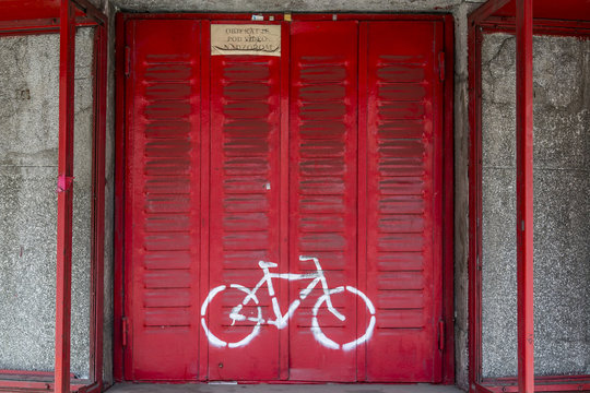 Bike sign on red shutters