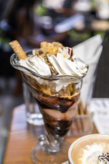 Sundae chocolate dessert, swirls of delightful fruit ice-cream in a glass cup