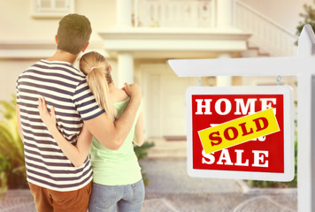 Loving couple looking at their dream house