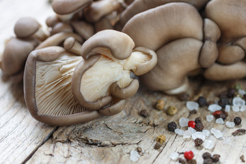 Fresh oyster mushrooms on wooden table. Shallow depth of field