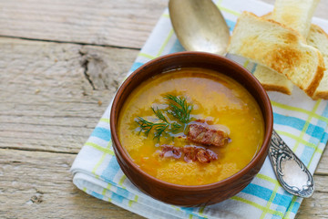 Traditional homemade  pea soup with bacon, herbs and croutons