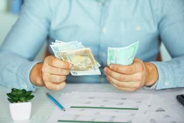 Man working on financial report at the office, close-up