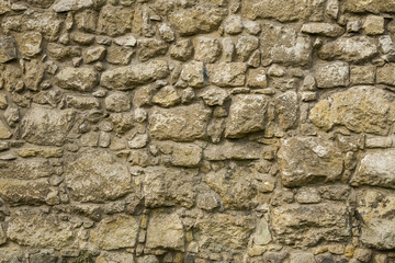Fragment of ancient stone walls, the Mediterranean, the Roman tradition.
