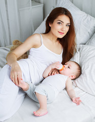 Obraz na płótnie Canvas mother and baby at home