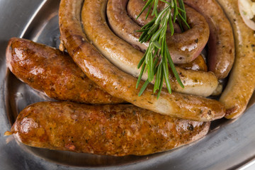 hot smoked sausages on metal plate