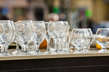 Open-air restaurant. Wine glasses.