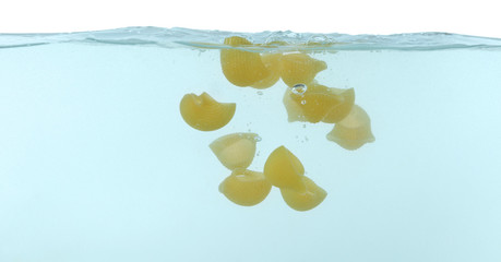 Falling pasta in water