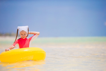 Adorable little girl enjoy beach summer vacation