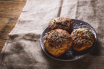 Freshly baked homemade bread on rustic wood background