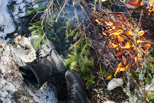 Boots dried by the campfire