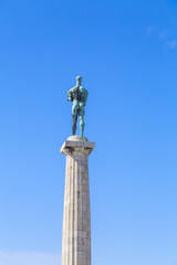 Fototapeta na wymiar Monument sculpture of the Belgrade Winner made of bronze, located in Kalemegdan, Belgrade, Serbia