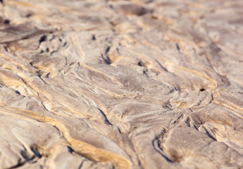 Sand surface with the relief formed by water currents