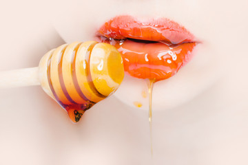 Female lips with honey
