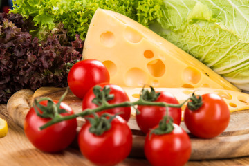 yellow cheese with fresh vegetables