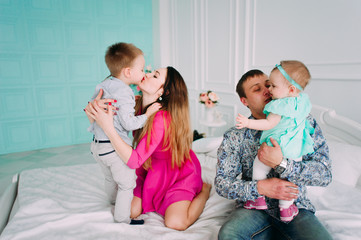 Beautiful family portrait spending time together at studio