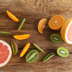 Fruit slices on wooden background