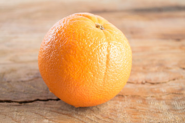 Orange fruit on wooden background