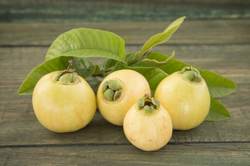 Syzygium Jambos rose apple on wooden background