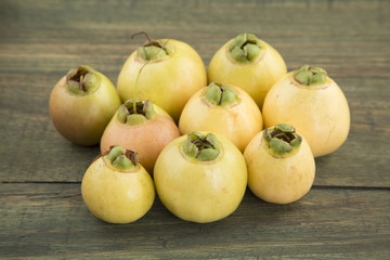 Syzygium Jambos rose apple on wooden background