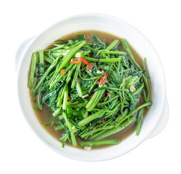 Stir Fried Water Spinach or pak boong fai daeng on white dish,clipping path