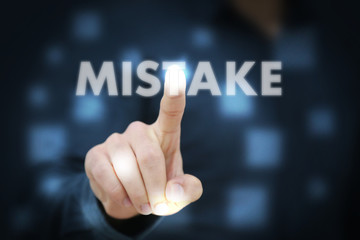 Businessman touching Mistake