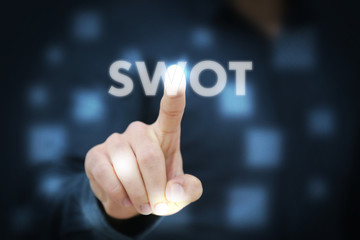 Businessman touching Swot