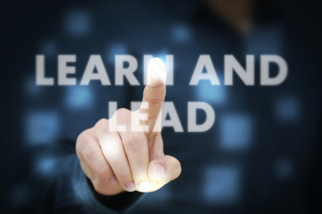 Businessman touching Learn And Lead