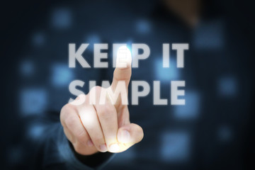 Businessman touching Keep It Simple