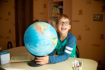 Schoolboy with globe