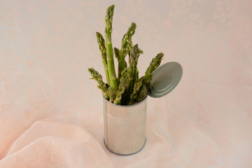 Bunch of fresh raw asparagus in can