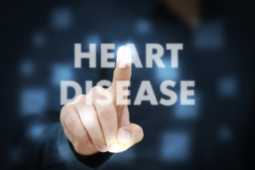 Businessman touching Heart Disease