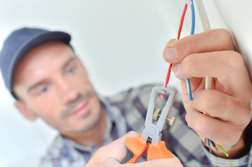 Electrician snipping a wire