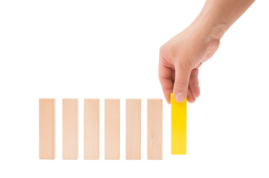 making up a line of wooden toy blocks on white background with clipping path