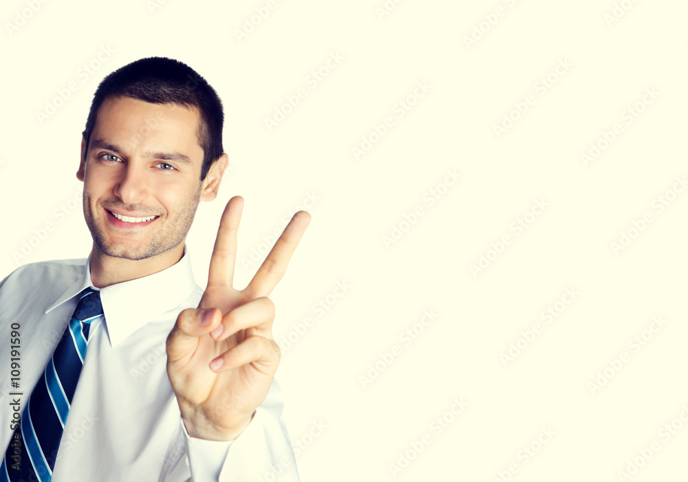 Wall mural happy smiling businessman showing two fingers