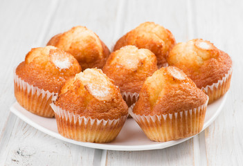 baked muffins on white  wooden
