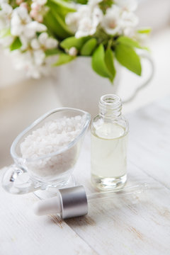 spa salt  with flower  with massage oil - flowers background