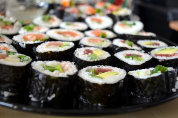 sushi rolls served on a plate