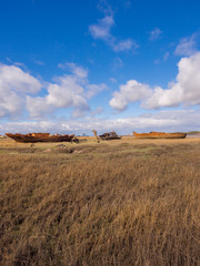 Old wooden and metal boats at Fleetwood Boat Graveyard, Fleetwood, Lancashire, UK
